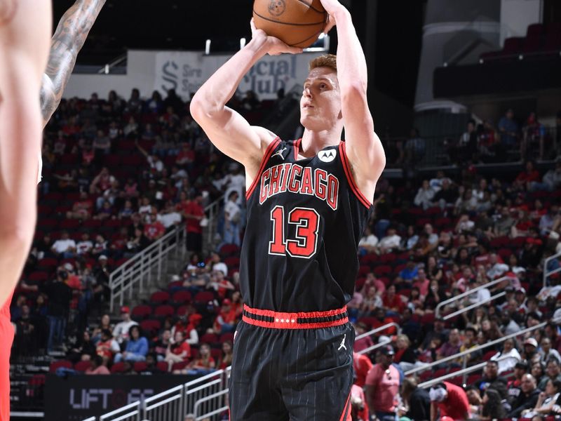 HOUSTON, TX - MARCH 15: Kevin Huerter #13 of Chicago Bulls shoots a three point basket during the game against the Houston Rockets on March 15, 2025 at the Toyota Center in Houston, Texas. NOTE TO USER: User expressly acknowledges and agrees that, by downloading and or using this photograph, User is consenting to the terms and conditions of the Getty Images License Agreement. Mandatory Copyright Notice: Copyright 2025 NBAE (Photo by Logan Riely/NBAE via Getty Images)