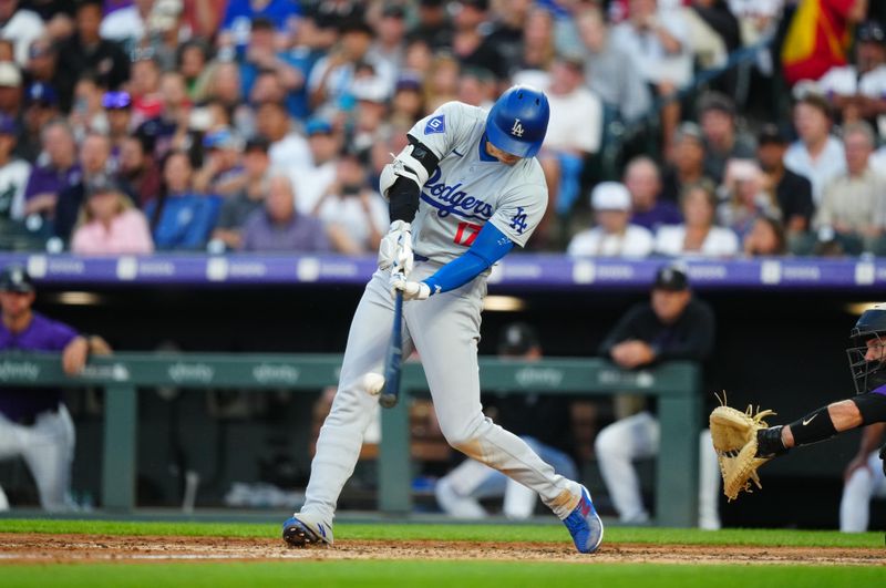 Jun 19, 2024; Denver, Colorado, USA; Los Angeles Dodgers designated hitter  Shohei Ohtani (17) singles in the sixth inning against the Colorado Rockies at Coors Field. Mandatory Credit: Ron Chenoy-USA TODAY Sports
