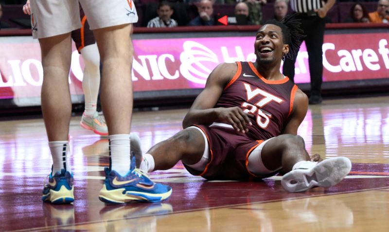 Feb 4, 2023; Blacksburg, Virginia, USA; Virginia Tech Hokies forward Justyn Mutts (25) smiles after getting fouled in the second half against the Virginia Cavaliers at Cassell Coliseum. Mandatory Credit: Lee Luther Jr.-USA TODAY Sports