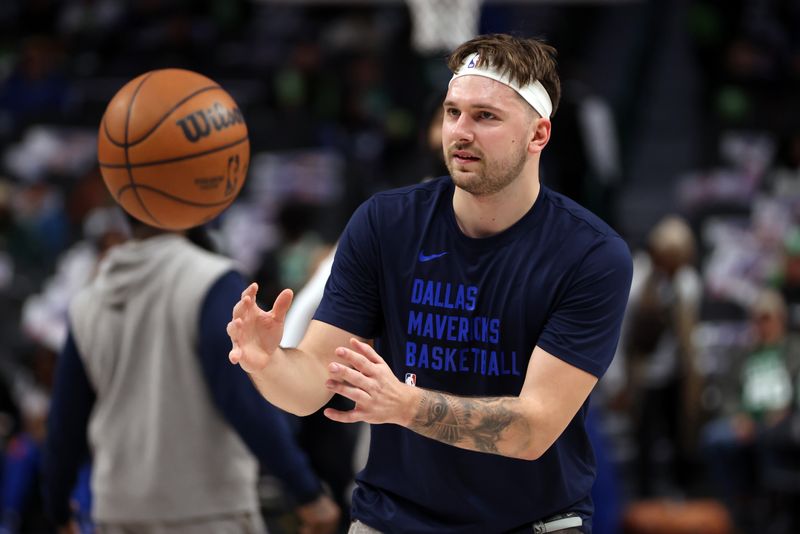 DALLAS, TEXAS - JANUARY 22: Luka Doncic #77 of the Dallas Mavericks catches a ball before the game against the Boston Celtics at American Airlines Center on January 22, 2024 in Dallas, Texas. NOTE TO USER: User expressly acknowledges and agrees that, by downloading and or using this photograph, User is consenting to the terms and conditions of the Getty Images License Agreement. (Photo by Tim Heitman/Getty Images)