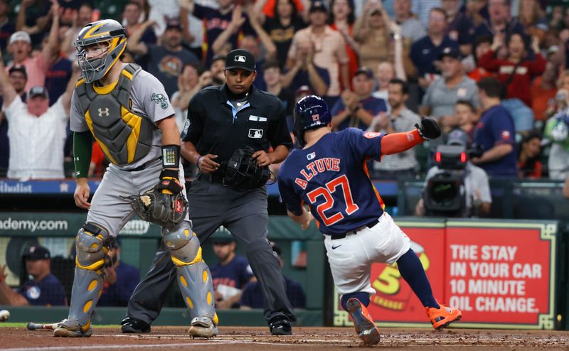 May 15, 2024; Houston, Texas, USA; Houston Astros second baseman Jose Altuve (27) scores against the Oakland Athletics in the first inning at Minute Maid Park. Mandatory Credit: Thomas Shea-USA TODAY Sports