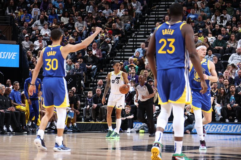 SALT LAKE CITY, UT - FEBRUARY 15: Keyonte George #3 of the Utah Jazz dribbles the ball against Stephen Curry #30 and Draymond Green #23 of the Golden State Warriors during the game on February 15, 2024 at Delta Center in Salt Lake City, Utah. NOTE TO USER: User expressly acknowledges and agrees that, by downloading and or using this Photograph, User is consenting to the terms and conditions of the Getty Images License Agreement. Mandatory Copyright Notice: Copyright 2024 NBAE (Photo by Melissa Majchrzak/NBAE via Getty Images)