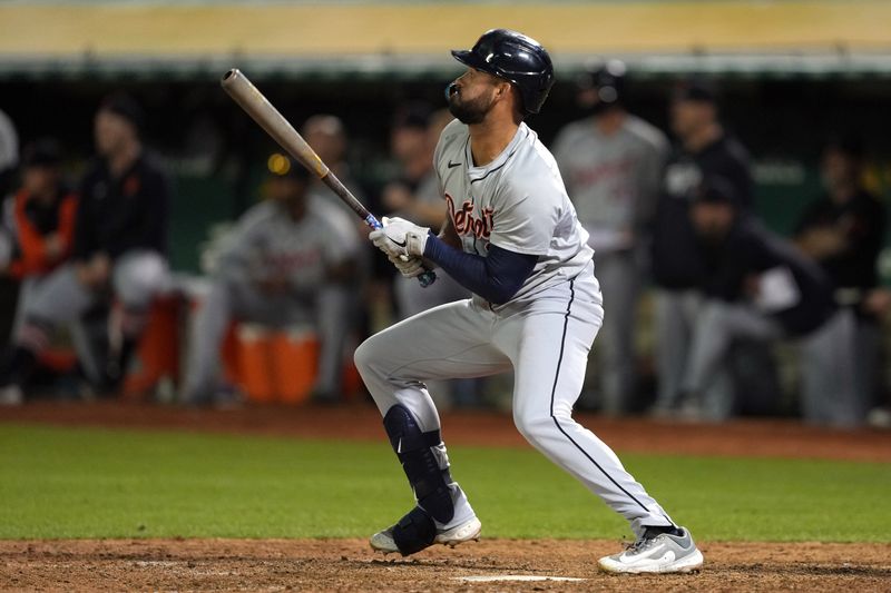 Sep 6, 2024; Oakland, California, USA; Detroit Tigers left fielder Riley Greene (31) hits an RBI single against the Oakland Athletics during the twelfth inning at Oakland-Alameda County Coliseum. Mandatory Credit: Darren Yamashita-Imagn Images