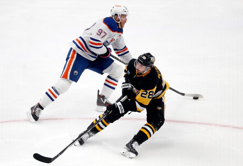 Mar 10, 2024; Pittsburgh, Pennsylvania, USA;  Edmonton Oilers center Connor McDavid (97) skates with the puck around defenseman Marcus Pettersson (28) during the third period at PPG Paints Arena. The Oilers won 4-0. Mandatory Credit: Charles LeClaire-USA TODAY Sports