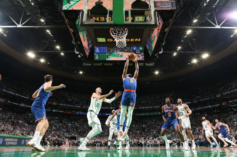 BOSTON, MA - APRIL 11: Precious Achiuwa #5 of the New York Knicks rebounds the ball during the game against the Boston Celtics on April 11, 2024 at the TD Garden in Boston, Massachusetts. NOTE TO USER: User expressly acknowledges and agrees that, by downloading and or using this photograph, User is consenting to the terms and conditions of the Getty Images License Agreement. Mandatory Copyright Notice: Copyright 2024 NBAE  (Photo by Nathaniel S. Butler/NBAE via Getty Images)