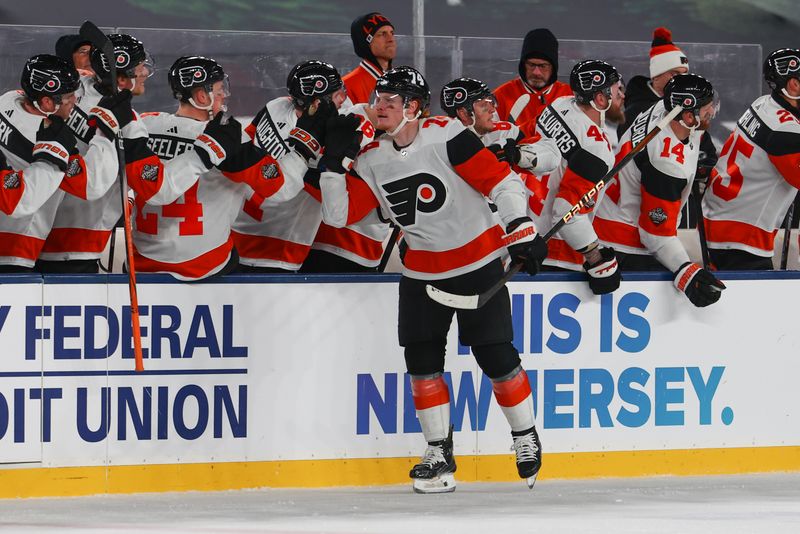 Feb 17, 2024; East Rutherford, New Jersey, USA; Philadelphia Flyers right wing Owen Tippett (74) celebrates his goal against the New Jersey Devils during the second period in a Stadium Series ice hockey game at MetLife Stadium. Mandatory Credit: Ed Mulholland-USA TODAY Sports