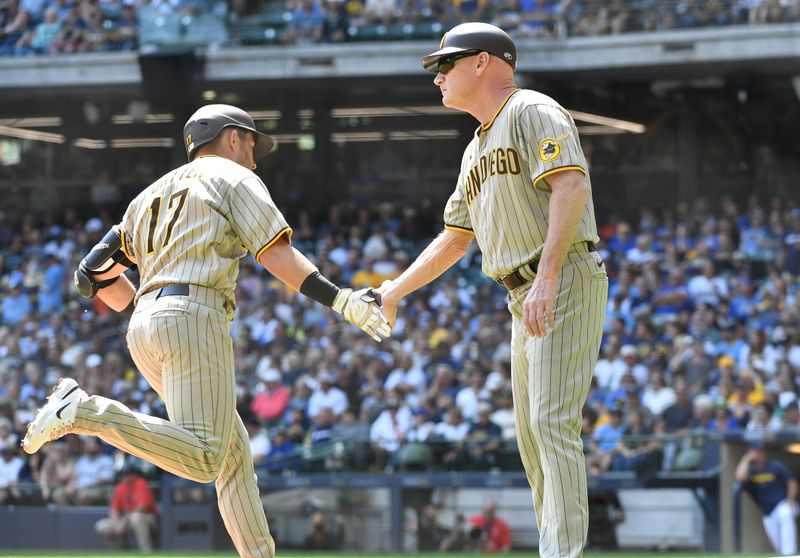 Aug 27, 2023; Milwaukee, Wisconsin, USA; San Diego Padres third base coach & infield instructor Matt Williams (18) congratulates San Diego Padres second baseman Matthew Batten (17) after hitting a home run against the Milwaukee Brewers in the second inning at American Family Field. Mandatory Credit: Michael McLoone-USA TODAY Sports