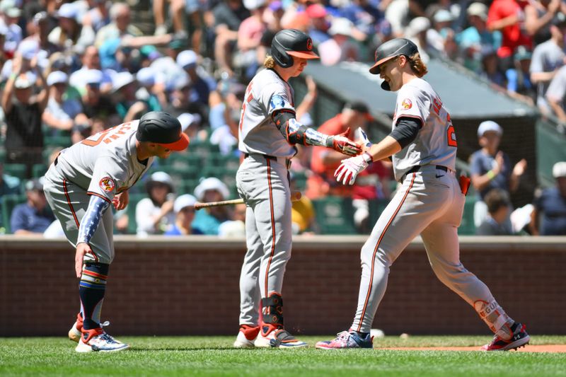 Jul 4, 2024; Seattle, Washington, USA;  Baltimore Orioles shortstop Gunnar Henderson (2) celebrates with designated hitter Heston Kjerstad (13) and catcher James McCann (27) after hitting a 2-run home run against the Seattle Mariners during the third inning at T-Mobile Park. Mandatory Credit: Steven Bisig-USA TODAY Sports
