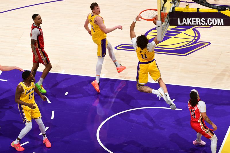 LOS ANGELES, CA - MARCH 4: Jaxson Hayes #11 of the Los Angeles Lakers dunks the ball during the game against the New Orleans Pelicans on March 4, 2025 at Crypto.Com Arena in Los Angeles, California. NOTE TO USER: User expressly acknowledges and agrees that, by downloading and/or using this Photograph, user is consenting to the terms and conditions of the Getty Images License Agreement. Mandatory Copyright Notice: Copyright 2025 NBAE (Photo by Adam Pantozzi/NBAE via Getty Images)