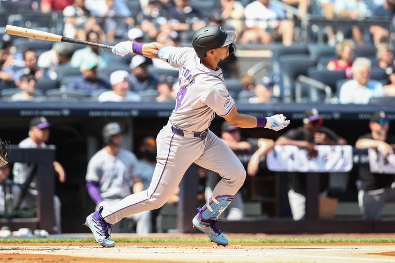 Aug 24, 2024; Bronx, New York, USA;  Colorado Rockies shortstop Ezequiel Tovar (14) hits a double in the first inning against the New York Yankees at Yankee Stadium. Mandatory Credit: Wendell Cruz-USA TODAY Sports