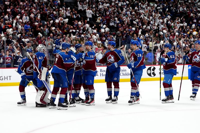 Apr 28, 2024; Denver, Colorado, USA; Members of the Colorado Avalanche celebrate defeating the Winnipeg Jets following game four of the first round of the 2024 Stanley Cup Playoffs at Ball Arena. Mandatory Credit: Ron Chenoy-USA TODAY Sports