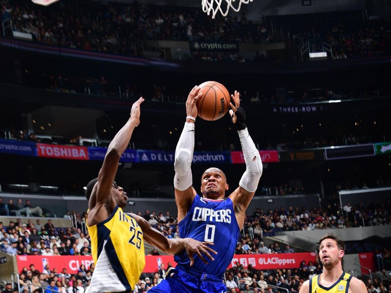 LOS ANGELES, CA - MARCH 25: Russell Westbrook #0 of the LA Clippers drives to the basket during the game against the Indiana Pacers on March 25, 2024 at Crypto.Com Arena in Los Angeles, California. NOTE TO USER: User expressly acknowledges and agrees that, by downloading and/or using this Photograph, user is consenting to the terms and conditions of the Getty Images License Agreement. Mandatory Copyright Notice: Copyright 2024 NBAE (Photo by Adam Pantozzi/NBAE via Getty Images)