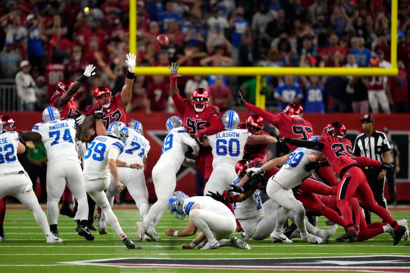 Detroit Lions place kicker Jake Bates (39) kicks a 52-yard field goal at the end of an NFL football game against the Houston Texans, Sunday, Nov. 10, 2024, in Houston. The Lions won 26-23. (AP Photo/David J. Phillip)
