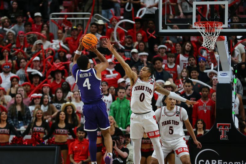 Feb 20, 2024; Lubbock, Texas, USA;  TCU Horned Frogs guard Jameer Nelson Jr (4) shoots over Texas Tech Red Raiders guard Chance McMillian (0) in the second half at United Supermarkets Arena. Mandatory Credit: Michael C. Johnson-USA TODAY Sports