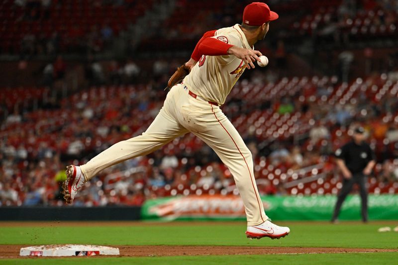 Jul 27, 2024; St. Louis, Missouri, USA; St. Louis Cardinals third baseman Nolan Arenado (28) mishandles the ball against the Washington Nationals during the seventh inning at Busch Stadium. Mandatory Credit: Jeff Le-USA TODAY Sports