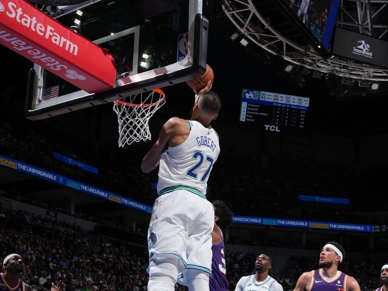 MINNEAPOLIS, MN -  APRIL 14: Rudy Gobert #27 of the Minnesota Timberwolves drives to the basket during the game against the Phoenix Suns on April 14, 2024 at Target Center in Minneapolis, Minnesota. NOTE TO USER: User expressly acknowledges and agrees that, by downloading and or using this Photograph, user is consenting to the terms and conditions of the Getty Images License Agreement. Mandatory Copyright Notice: Copyright 2024 NBAE (Photo by Jordan Johnson/NBAE via Getty Images)