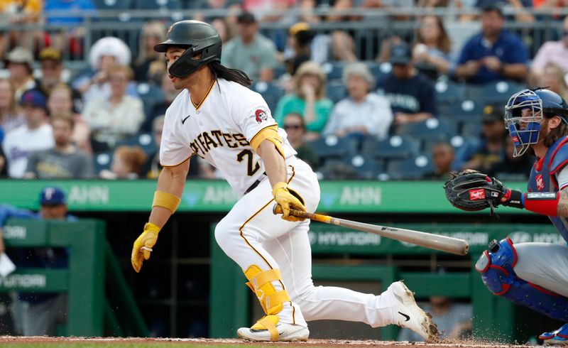 May 22, 2023; Pittsburgh, Pennsylvania, USA;  Pittsburgh Pirates right fielder Connor Joe (2) drives in a run against the Texas Rangers during the second inning at PNC Park. Mandatory Credit: Charles LeClaire-USA TODAY Sports