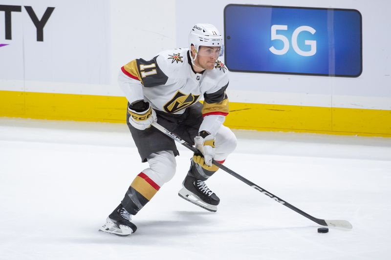 Feb 24, 2024; Ottawa, Ontario, CAN; Vegas Golden Knights left wing Mason Morelli (11) skates with the puck in the third period against the Ottawa Senators at the Canadian Tire Centre. Mandatory Credit: Marc DesRosiers-USA TODAY Sports