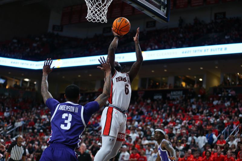 Feb 20, 2024; Lubbock, Texas, USA;  Texas Tech Red Raiders guard Joe Toussaint (6) shoots against TCU Horned Frogs guard Avery Anderson III (3) in the first half at United Supermarkets Arena. Mandatory Credit: Michael C. Johnson-USA TODAY Sports