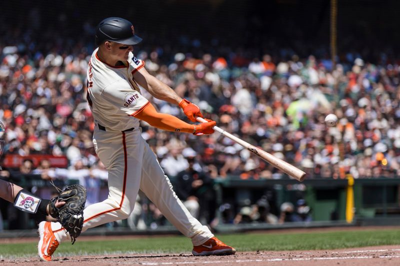 Apr 28, 2024; San Francisco, California, USA;  San Francisco Giants third baseman Matt Chapman (26) hits a single against the Pittsburgh Pirates during the third inning at Oracle Park. Mandatory Credit: John Hefti-USA TODAY Sports