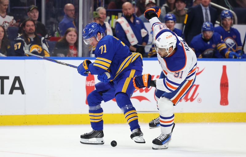 Mar 9, 2024; Buffalo, New York, USA;  Buffalo Sabres left wing Victor Olofsson (71) and Edmonton Oilers left wing Evander Kane (91) try to control the loose puck during the third period at KeyBank Center. Mandatory Credit: Timothy T. Ludwig-USA TODAY Sports