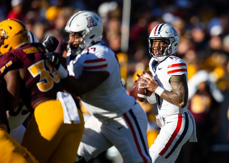 Nov 25, 2023; Tempe, Arizona, USA; Arizona Wildcats quarterback Noah Fifita (11) against the Arizona State Sun Devils in the first half of the Territorial Cup at Mountain America Stadium. Mandatory Credit: Mark J. Rebilas-USA TODAY Sports