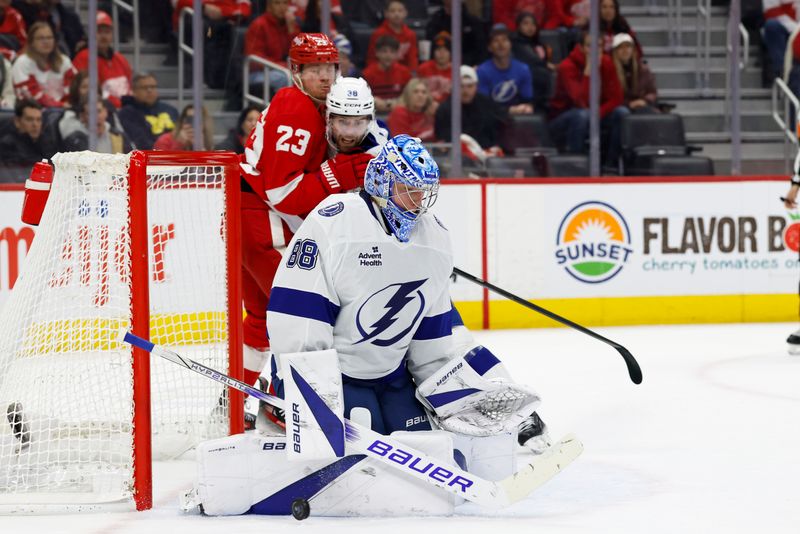 Jan 25, 2025; Detroit, Michigan, USA;  Tampa Bay Lightning goaltender Andrei Vasilevskiy (88) makes a save in the second period against the Detroit Red Wings at Little Caesars Arena. Mandatory Credit: Rick Osentoski-Imagn Images