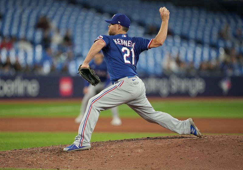 Sep 13, 2023; Toronto, Ontario, CAN; Texas Rangers relief pitcher Ian Kennedy (21) throws a pitch against the Toronto Blue Jays during the ninth inning at Rogers Centre. Mandatory Credit: Nick Turchiaro-USA TODAY Sports