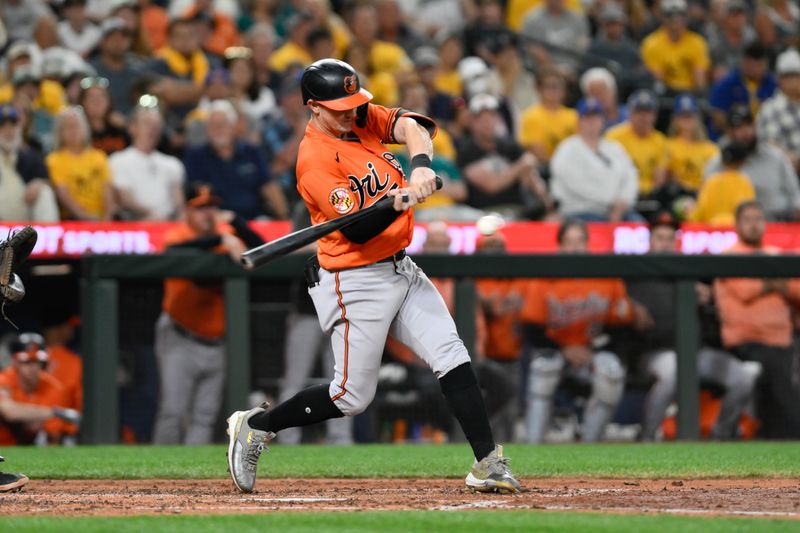 Aug 12, 2023; Seattle, Washington, USA; Baltimore Orioles left fielder Austin Hays (21) hits a single against the Seattle Mariners during the eighth inning at T-Mobile Park. Mandatory Credit: Steven Bisig-USA TODAY Sports