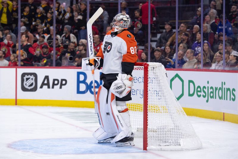 Oct 23, 2025; Ottawa, Ontario, CAN; Philadelphia Flyers goalie Dan Vladar (80) looks up the ice prior to the start of game against the Ottawa Senators at the Canadian Tire Centre. Mandatory Credit: Marc DesRosiers-IMAGN Images