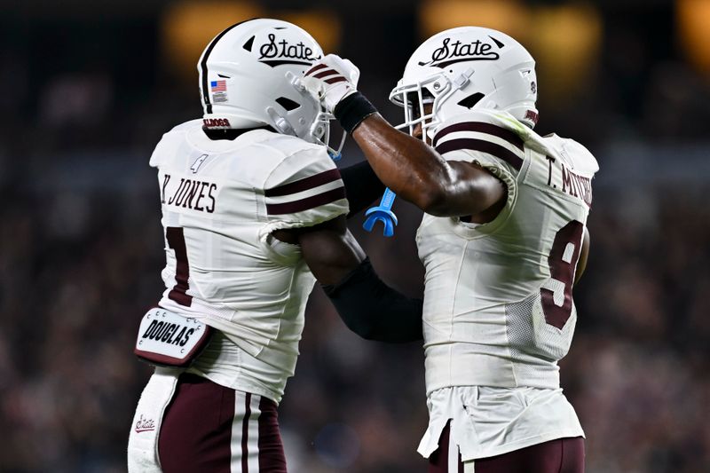 Oct 4, 2025; College Station, Texas, USA; Mississippi State Bulldogs cornerback Kelley Jones (1) and safety Tony Mitchell (9) celebrate a stop on fourth and one in the second quarter against the Texas A&M Aggies at Kyle Field. Mandatory Credit: Maria Lysaker-Imagn Images 