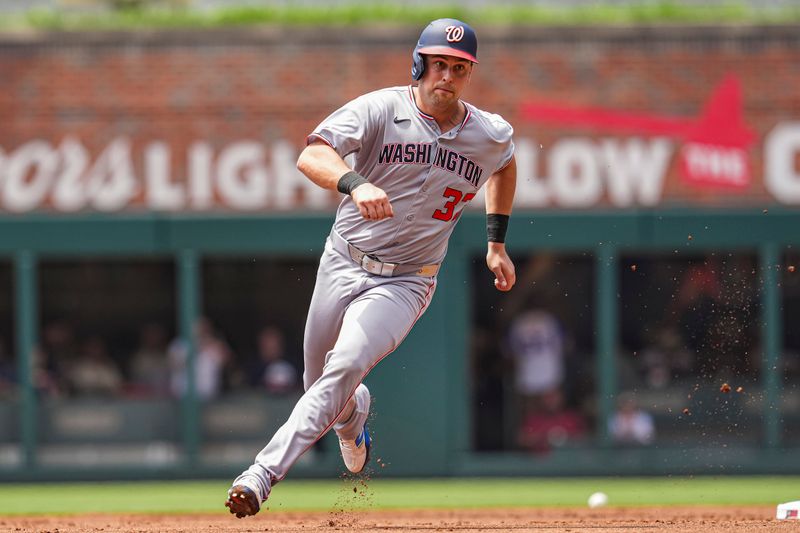 May 15, 2025; Cumberland, Georgia, USA; Washington Nationals first base Nathaniel Lowe (33) runs the bases against the Atlanta Braves during the second inning at Truist Park. Mandatory Credit: Dale Zanine-Imagn Images