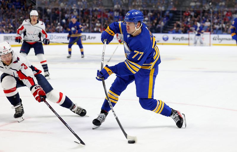 Apr 11, 2024; Buffalo, New York, USA;  Washington Capitals defenseman Nick Jensen (3) tries to block a shot by Buffalo Sabres right wing JJ Peterka (77) during the second period at KeyBank Center. Mandatory Credit: Timothy T. Ludwig-USA TODAY Sports