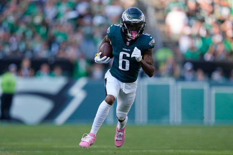 Philadelphia Eagles wide receiver DeVonta Smith (6) runs with the ball for a touchdown during the second half of an NFL football game against the Cleveland Browns on Sunday, Oct. 13, 2024, in Philadelphia. (AP Photo/Matt Slocum)