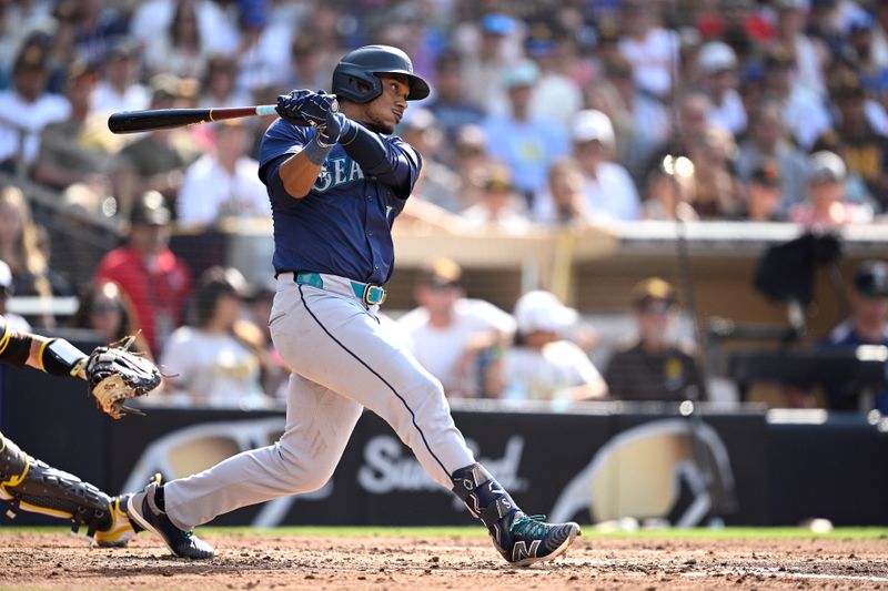 Jul 10, 2024; San Diego, California, USA; Seattle Mariners second baseman Jorge Polanco (7) hits a RBI single against the San Diego Padres during the fourth inning at Petco Park. Mandatory Credit: Orlando Ramirez-USA TODAY Sports