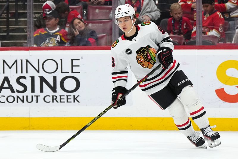 Nov 12, 2023; Sunrise, Florida, USA; Chicago Blackhawks center Connor Bedard (98) skates on the ice against the Florida Panthers during the second period at Amerant Bank Arena. Mandatory Credit: Jasen Vinlove-USA TODAY Sports