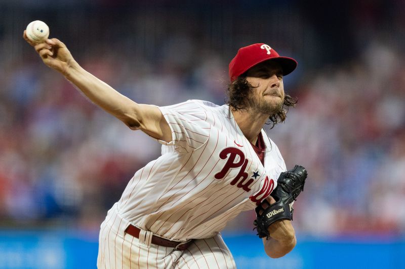 Aug 4, 2023; Philadelphia, Pennsylvania, USA; Philadelphia Phillies starting pitcher Aaron Nola (27) throws a pitch during the third inning against the Kansas City Royals at Citizens Bank Park. Mandatory Credit: Bill Streicher-USA TODAY Sports