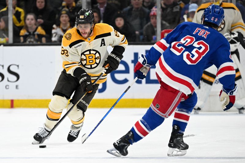 Mar 21, 2024; Boston, Massachusetts, USA; Boston Bruins right wing David Pastrnak (88) skates with the puck against New York Rangers defenseman Adam Fox (23) during the third period at the TD Garden. Mandatory Credit: Brian Fluharty-USA TODAY Sports