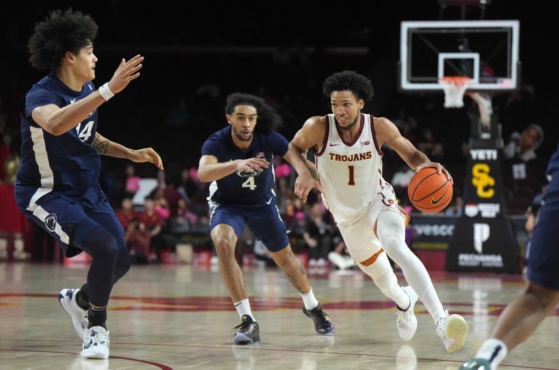 Feb 11, 2025; Los Angeles, California, USA; Southern California Trojans guard Desmond Claude (1) dribbles the ball against Penn State Nittany Lions guard Freddie Dilione V (4) and forward Zach Hicks (24)  in the second half at Galen Center. Mandatory Credit: Kirby Lee-Imagn Images