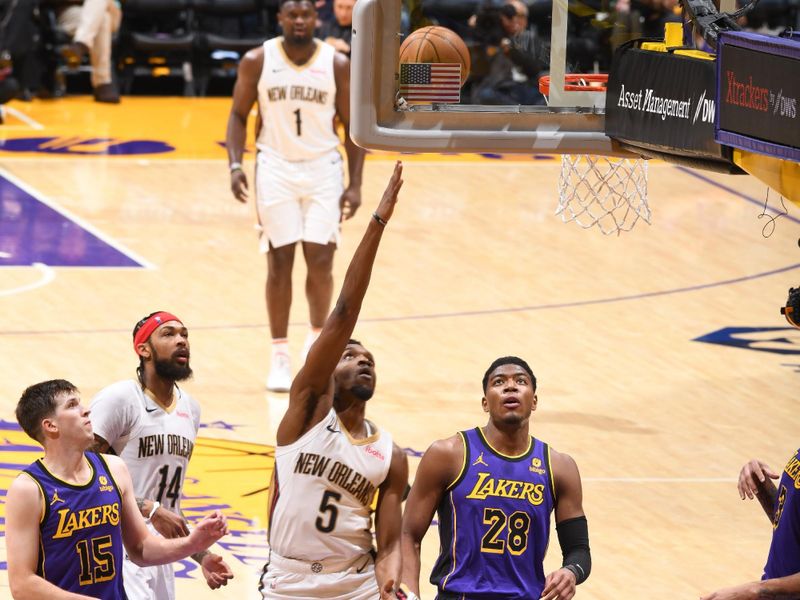 LOS ANGELES, CA - FEBRUARY 9: Herb Jones #5 of the New Orleans Pelicans drives to the basket during the game against the Los Angeles Lakers on February 9, 2024 at Crypto.Com Arena in Los Angeles, California. NOTE TO USER: User expressly acknowledges and agrees that, by downloading and/or using this Photograph, user is consenting to the terms and conditions of the Getty Images License Agreement. Mandatory Copyright Notice: Copyright 2024 NBAE (Photo by Andrew D. Bernstein/NBAE via Getty Images)