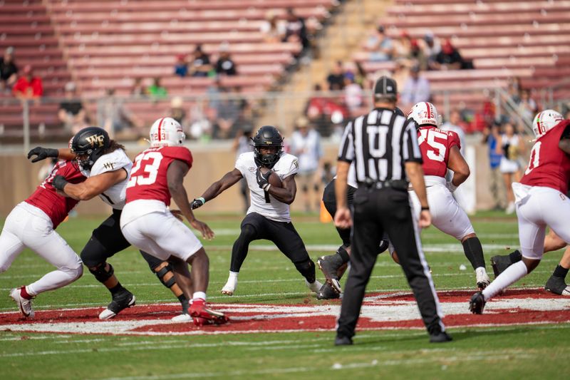 Oct 26, 2024; Stanford, California, USA;  Wake Forest Demon Deacons running back Demond Claiborne (1) runs the football during the second quarter against the Stanford Cardinal at Stanford Stadium. Mandatory Credit: Neville E. Guard-Imagn Images