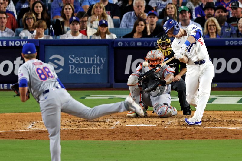 Oct 20, 2024; Los Angeles, California, USA; Los Angeles Dodgers catcher Will Smith (16) hits a two run home run during the third inning  against the New York Mets during game six of the NLCS for the 2024 MLB playoffs at Dodger Stadium. Mandatory Credit: Jason Parkhurst-Imagn Images