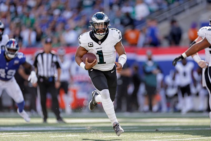 Philadelphia Eagles quarterback Jalen Hurts (1) runs with the ball during an NFL football game against the New York Giants Sunday, Oct. 20, 2024, in East Rutherford, N.J. (AP Photo/Adam Hunger)