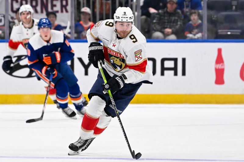 Jan 27, 2024; Elmont, New York, USA; Florida Panthers center Sam Bennett (9) skates with the puck against the New York Islanders during the third period at UBS Arena. Mandatory Credit: Dennis Schneidler-USA TODAY Sports