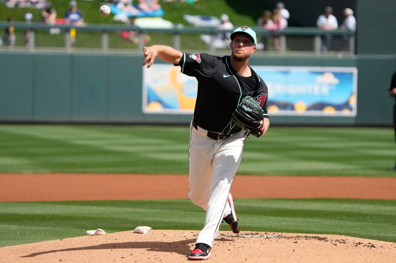 Mar 8, 2024; Salt River Pima-Maricopa, Arizona, USA; Arizona Diamondbacks starting pitcher Merrill Kelly (29) throws against the Chicago Cubs in the first inning at Salt River Fields at Talking Stick. Mandatory Credit: Rick Scuteri-USA TODAY Sports