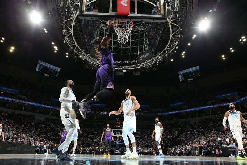 MINNEAPOLIS, MN -  DECEMBER 2: LeBron James #23 of the Los Angeles Lakers dunks the ball during the game against the Minnesota Timberwolves on December 2, 2024 at Target Center in Minneapolis, Minnesota. NOTE TO USER: User expressly acknowledges and agrees that, by downloading and or using this Photograph, user is consenting to the terms and conditions of the Getty Images License Agreement. Mandatory Copyright Notice: Copyright 2024 NBAE (Photo by David Sherman/NBAE via Getty Images)