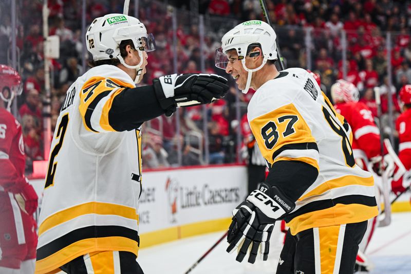 Oct 10, 2024; Detroit, Michigan, USA; Pittsburgh Penguins left wing Anthony Beauvillier (72) celebrates his goal with center Sidney Crosby (87) during the first period against the Detroit Red Wings at Little Caesars Arena. Mandatory Credit: Tim Fuller-Imagn Images