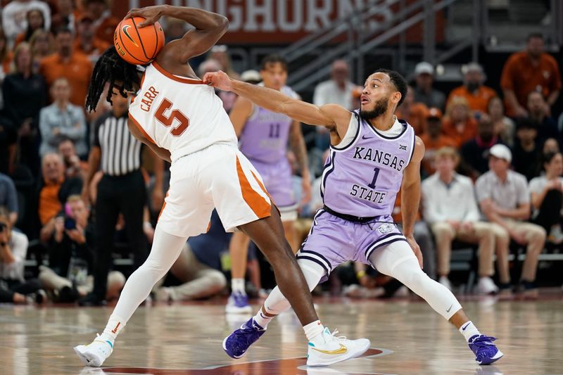 Jan 3, 2023; Austin, Texas, USA; Texas Longhorns guard Marcus Carr (5) attempts to keep the ball away from Kansas State Wildcats guard Markquis Nowell (1) during the second half at Moody Center. Mandatory Credit: Scott Wachter-USA TODAY Sports