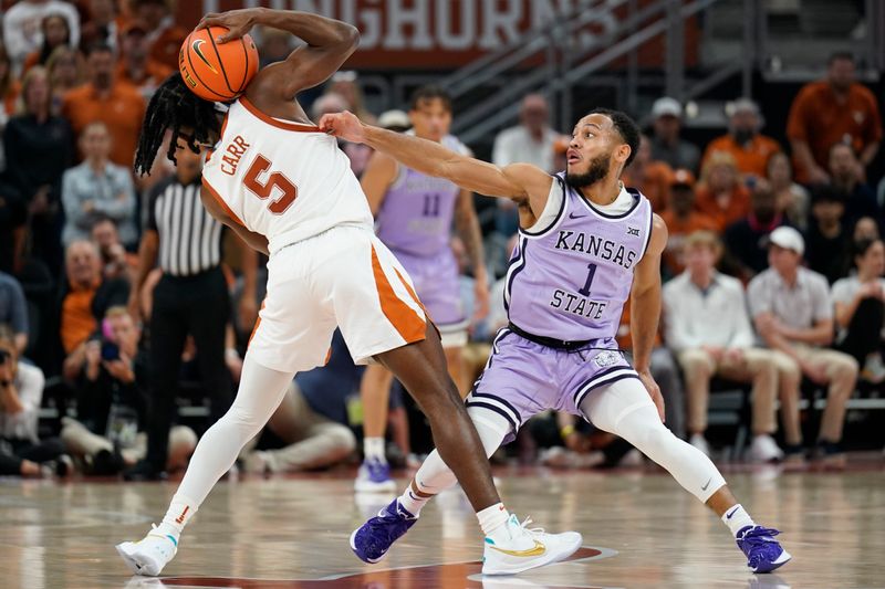 Jan 3, 2023; Austin, Texas, USA; Texas Longhorns guard Marcus Carr (5) attempts to keep the ball away from Kansas State Wildcats guard Markquis Nowell (1) during the second half at Moody Center. Mandatory Credit: Scott Wachter-USA TODAY Sports