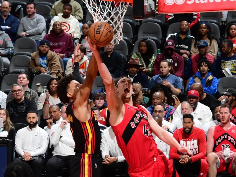 ATLANTA, GA - February 23:   Kelly Olynyk #41 of the Toronto Raptors drives to the basket during the game against the Atlanta Hawks on February 23, 2024 at State Farm Arena in Atlanta, Georgia.  NOTE TO USER: User expressly acknowledges and agrees that, by downloading and/or using this Photograph, user is consenting to the terms and conditions of the Getty Images License Agreement. Mandatory Copyright Notice: Copyright 2024 NBAE (Photo by Scott Cunningham/NBAE via Getty Images)